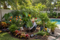 Landscaper planting tropical plants in Florida garden